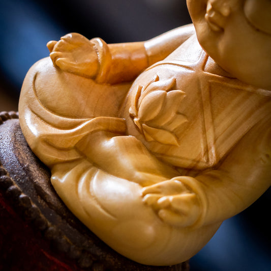 Seated Child Wood Figurine